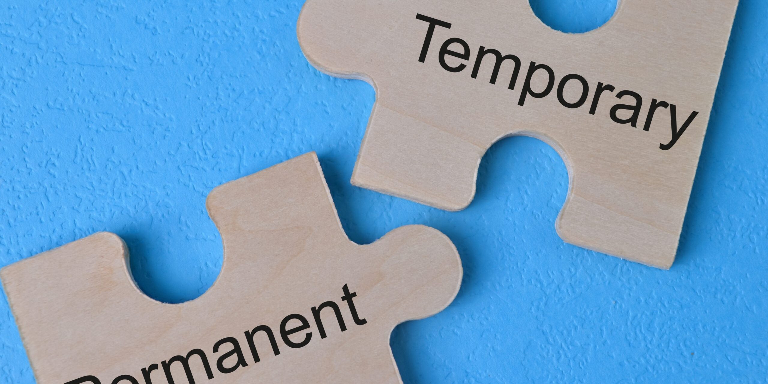Wooden,Jigsaw,Puzzle,With,Text,Temporary,And,Permanent