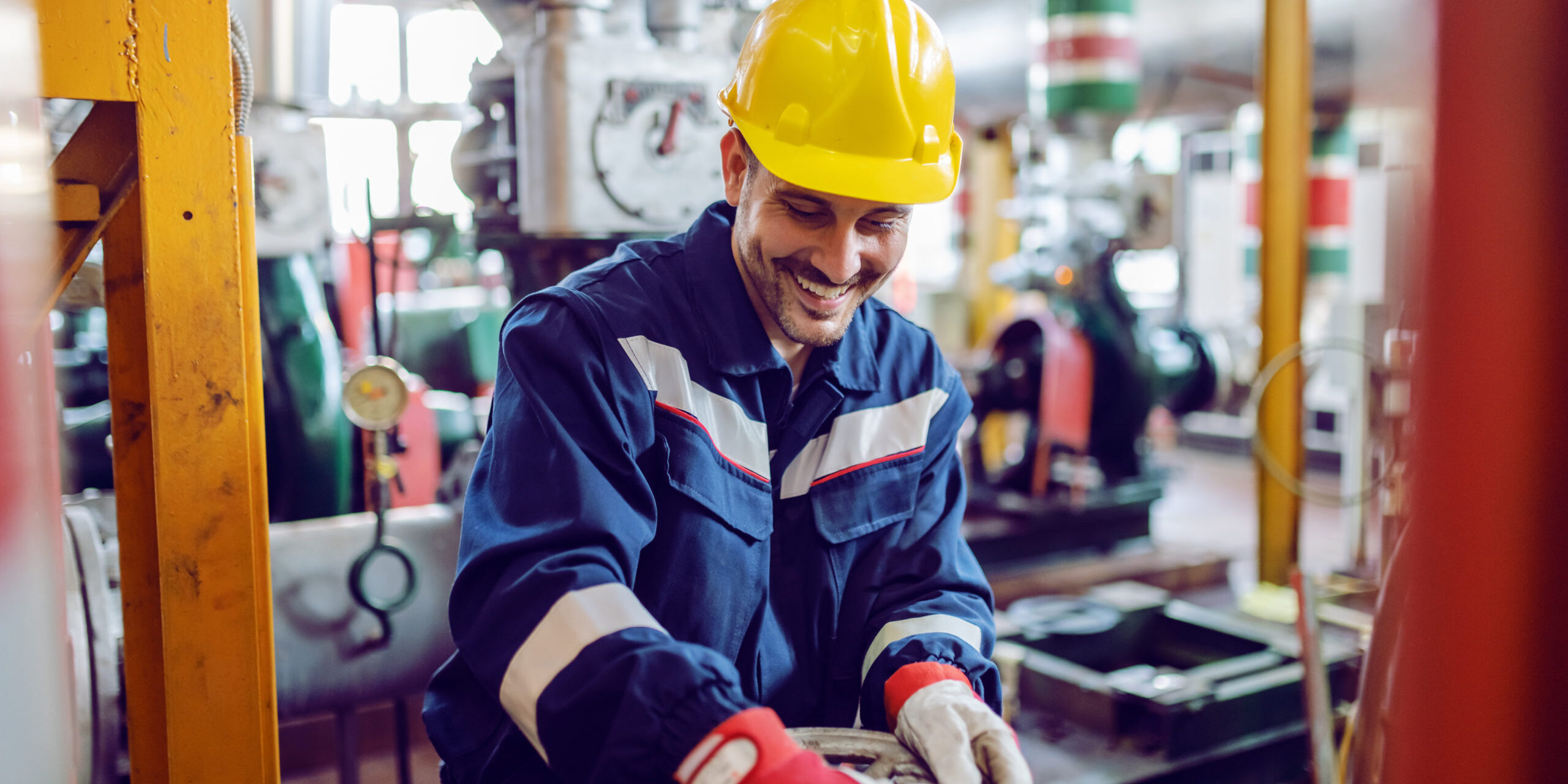 Smiling,Hardworking,Energy,Plant,Worker,In,Working,Suit,Screwing,Valve.