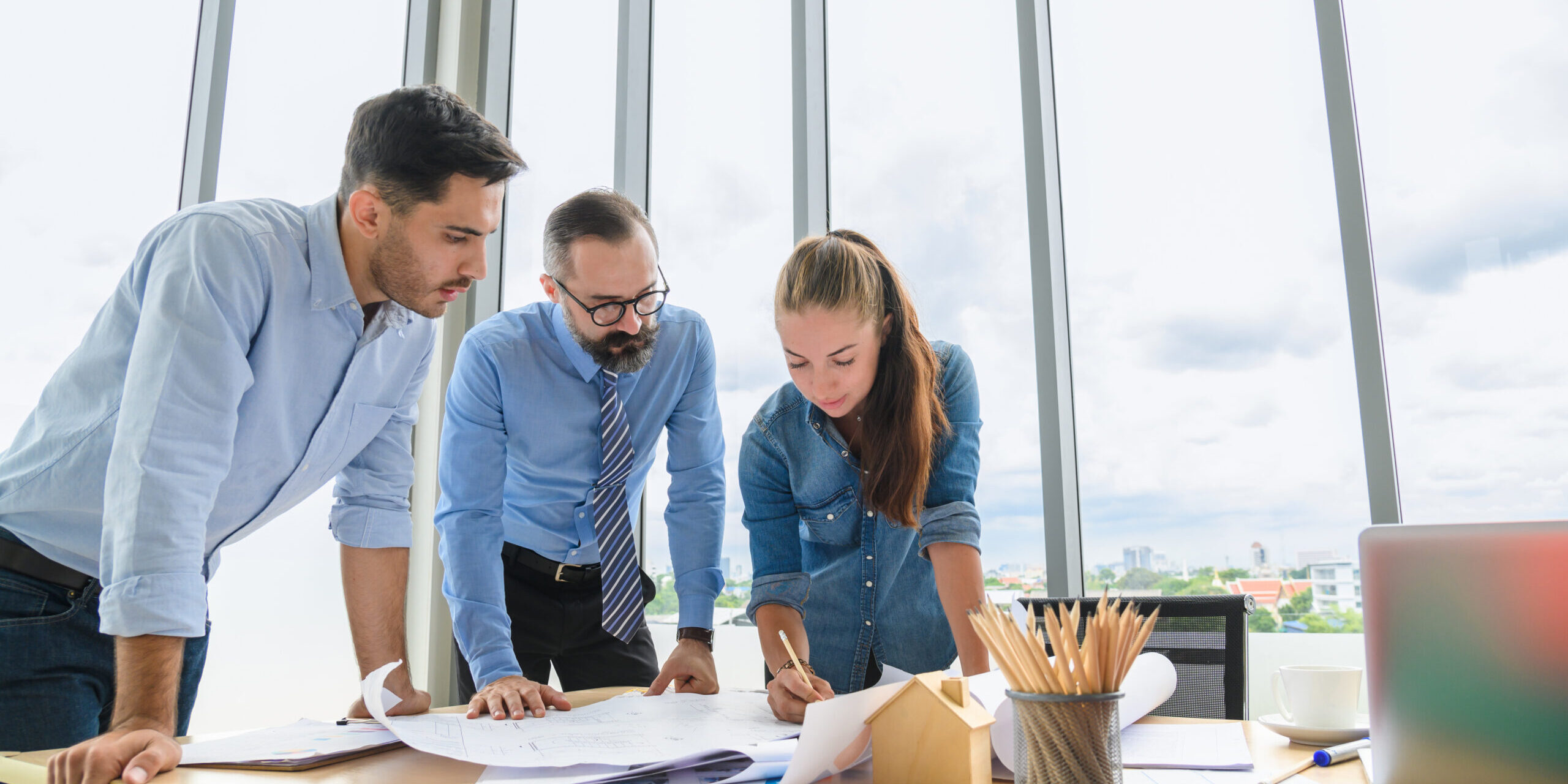 Engineers,Team,Meeting,For,Architectural,Project.,Architects,Discussing,Blueprint,With